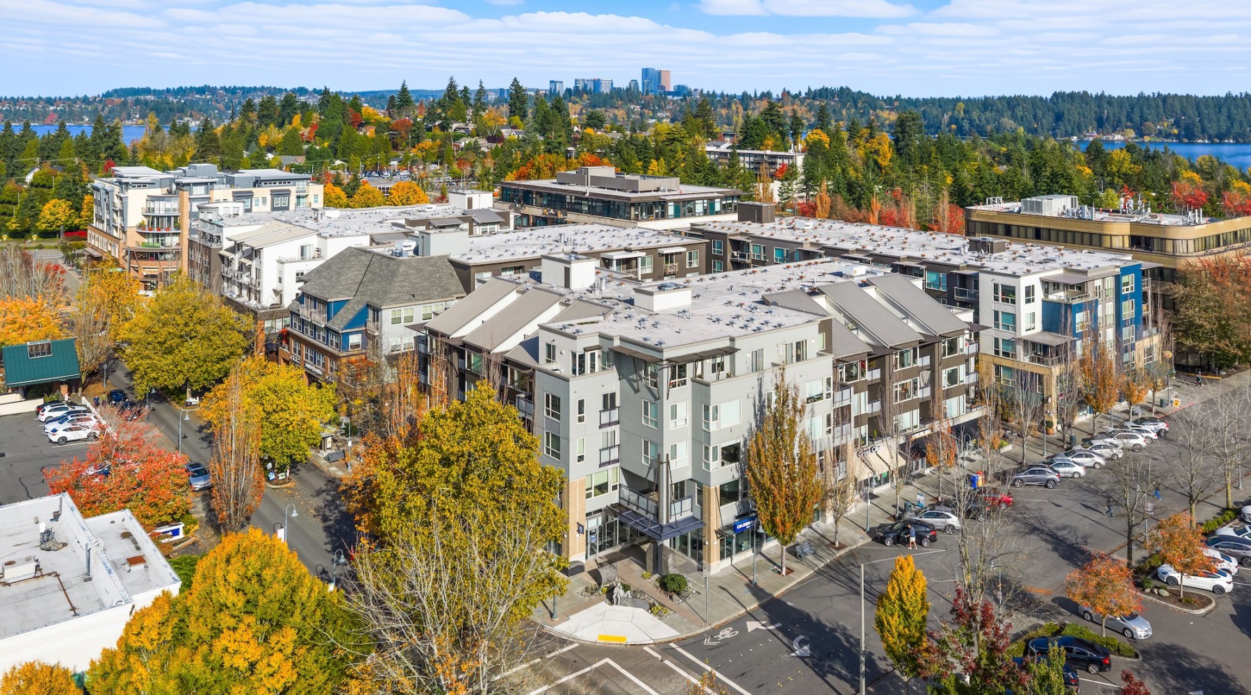 an apartment building surrounded by many trees